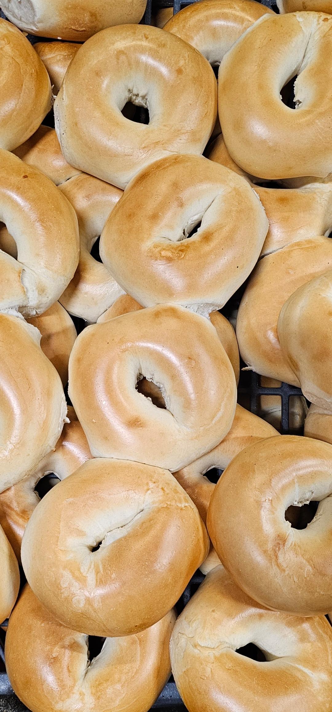 Cream cheese spread and bagel paired for breakfast