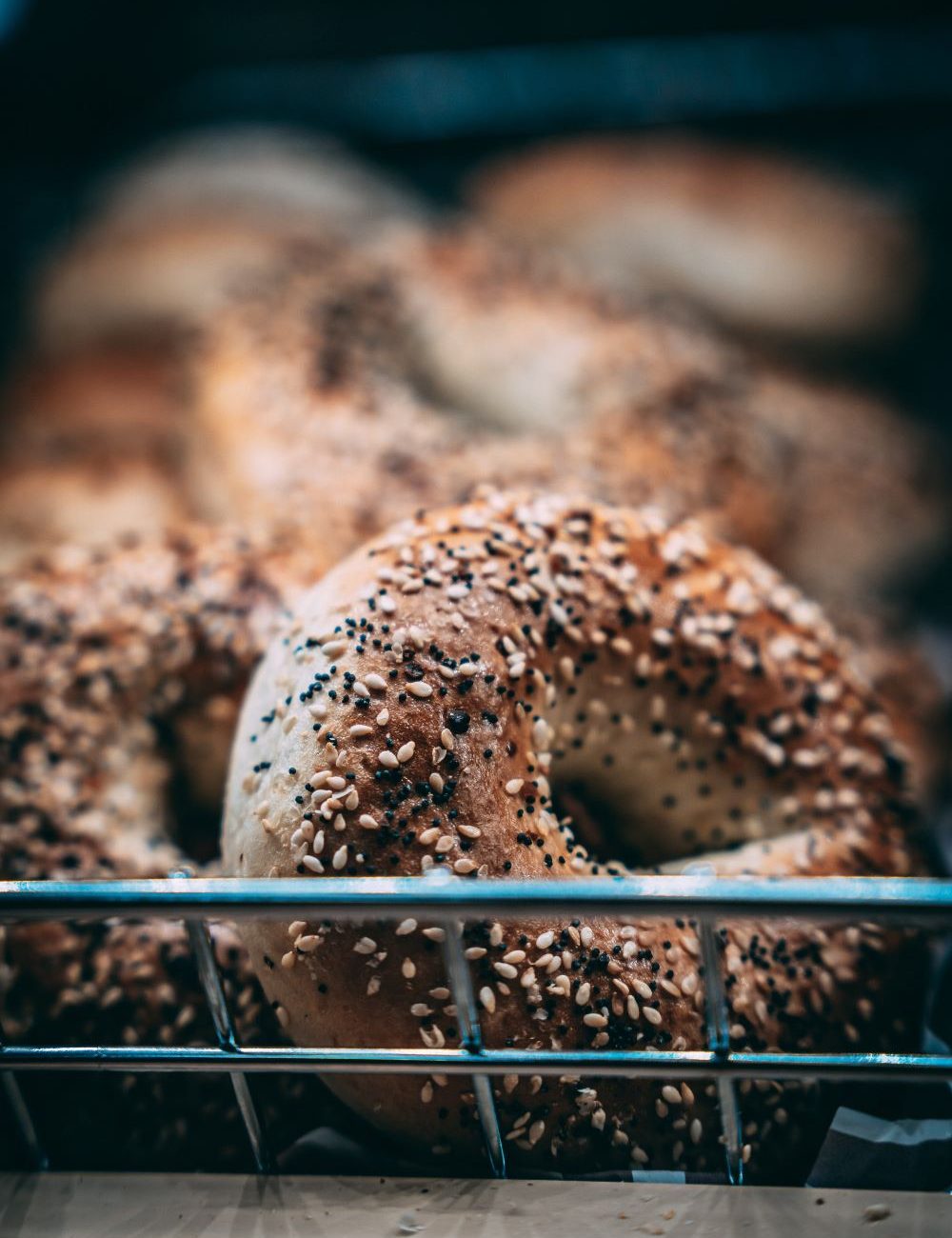 closeup-shot-bunch-bagels-covered-sesame-seeds